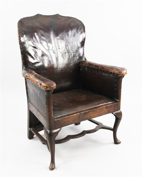 An 18th century boarded oak framed armchair,